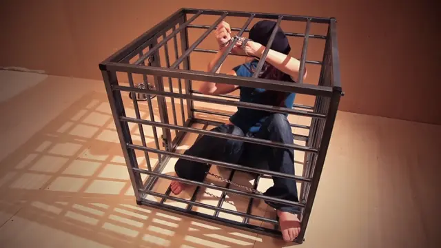 Poster: Cuffed In Her Cage